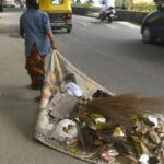 Dragging waste on mats and cardboards, pourakarmikas toil without basic resources