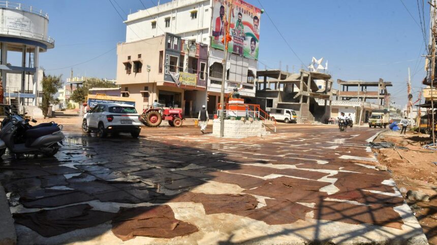 A village divided by a three-foot road